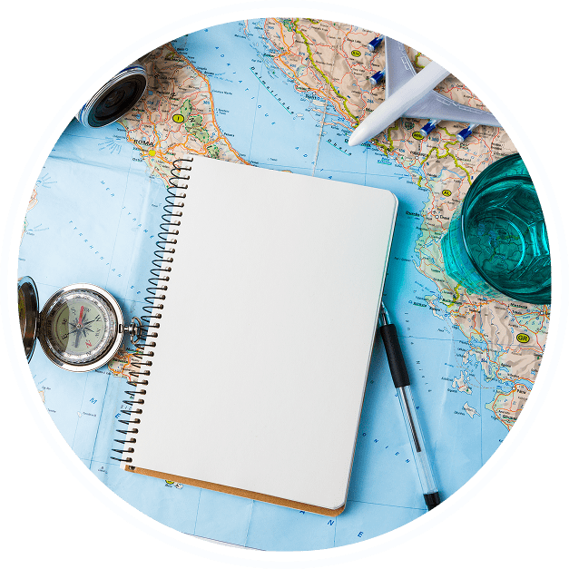 Group 4500 A notebook and pen on top of a map.