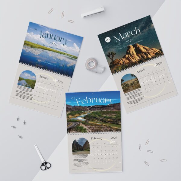 Three different calendars on a table with some paper
