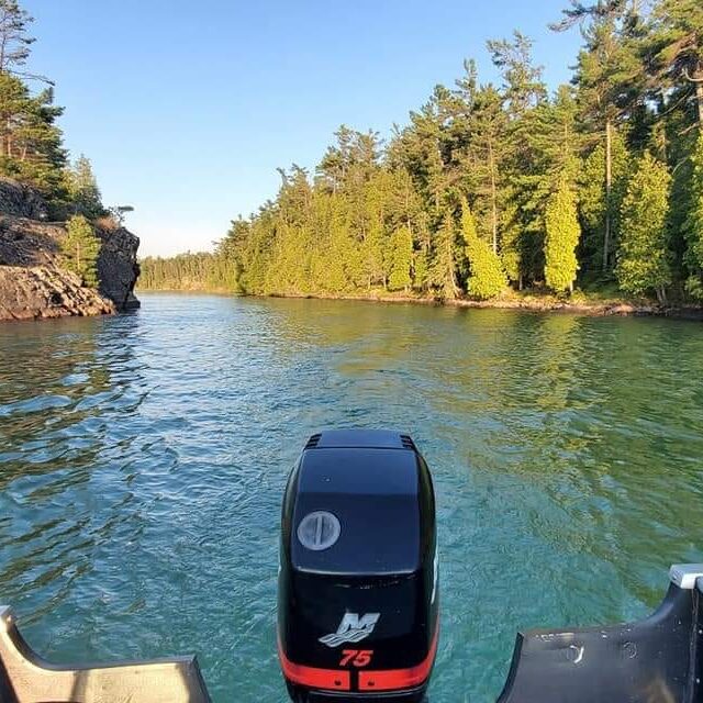 ty50 A boat is going down the river